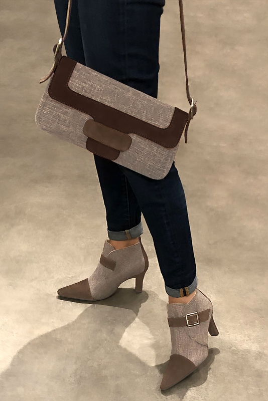 Women's chocolate brown and tan beige elegant ankle boots, with buckles at the front. Tapered toe. High kitten heels - Worn view
